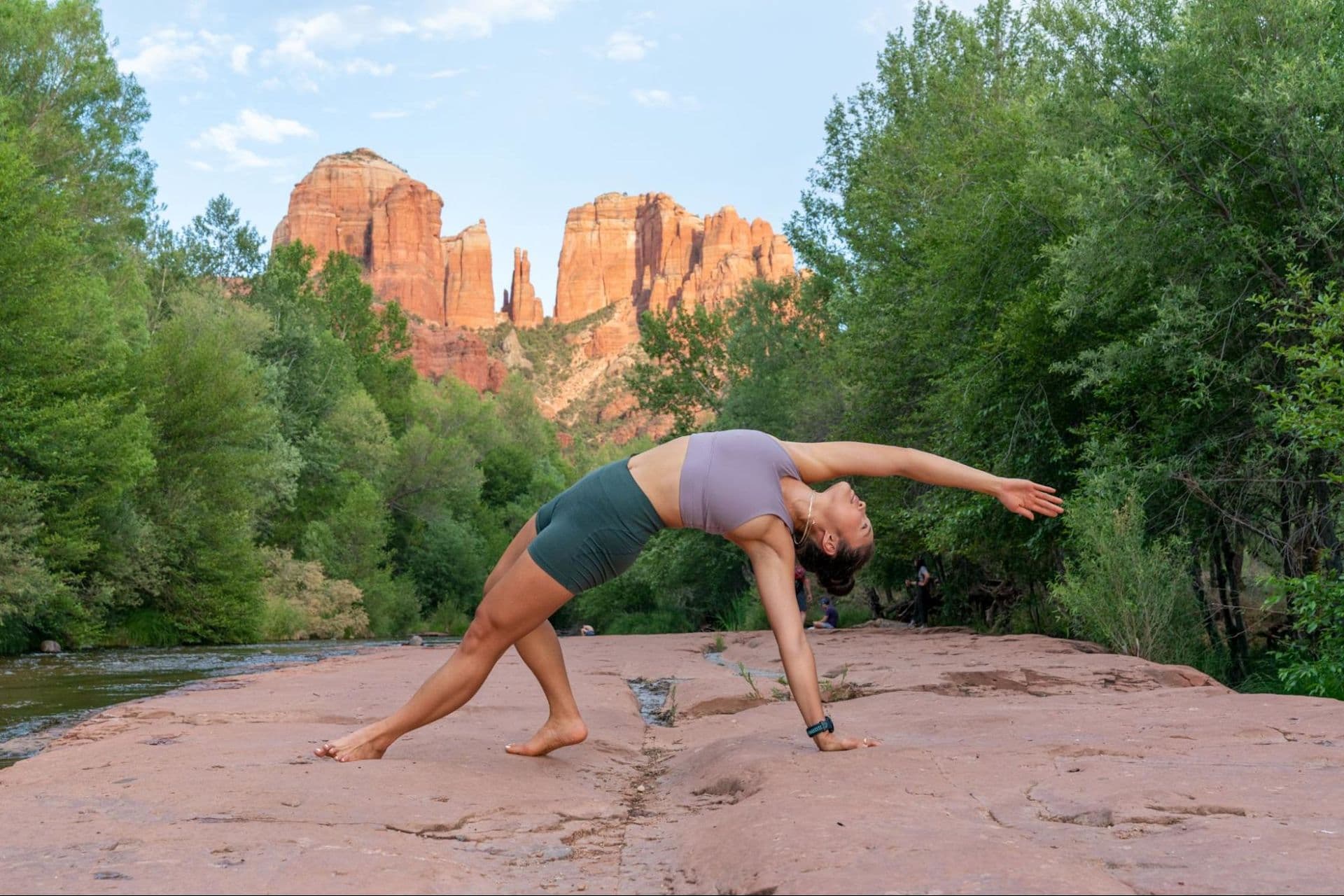 Woman does a yoga workout after learning what yoga is and how to get started with her practice.