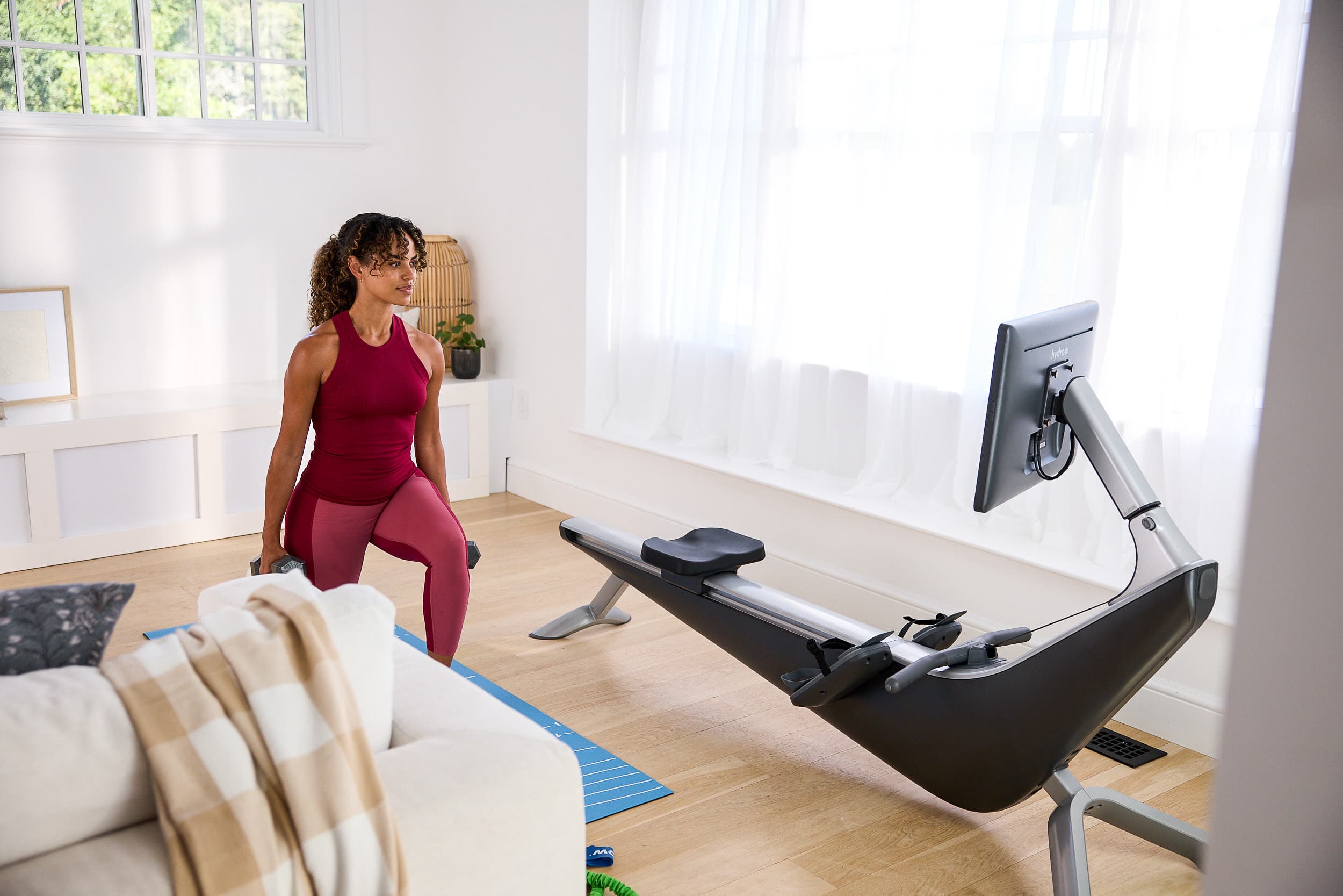 Woman works out in a home gym.