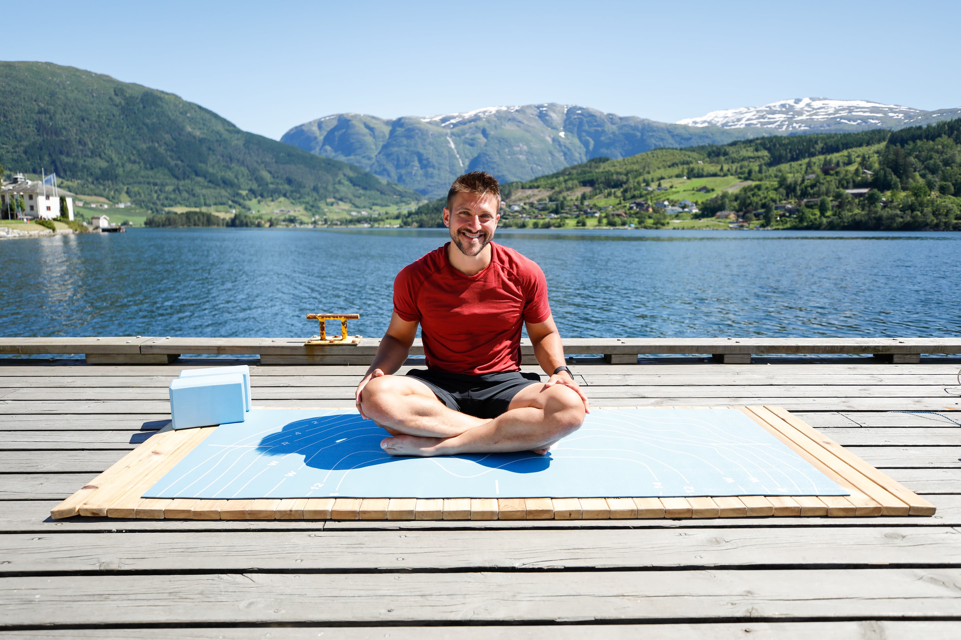 Hydrow Athlete Owen prepares for a yoga workout.