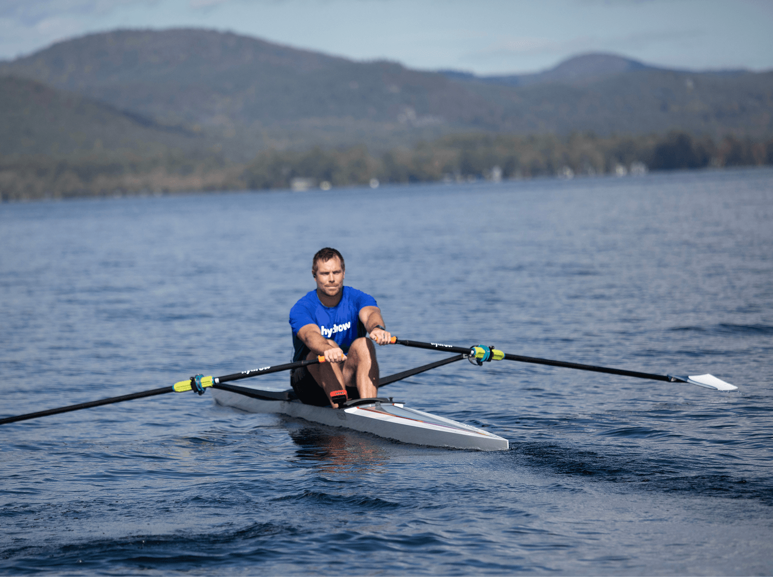 Coach James leading a HIIT row on Lake George