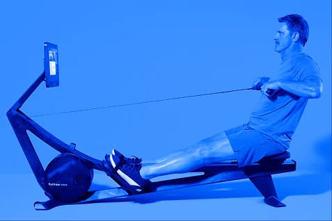 side view of man on a Hydrow Rower