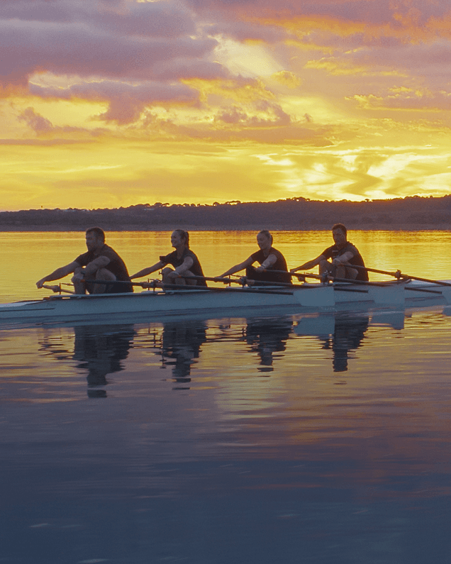 Hydrow Athletes rowing in Portugal at sunset