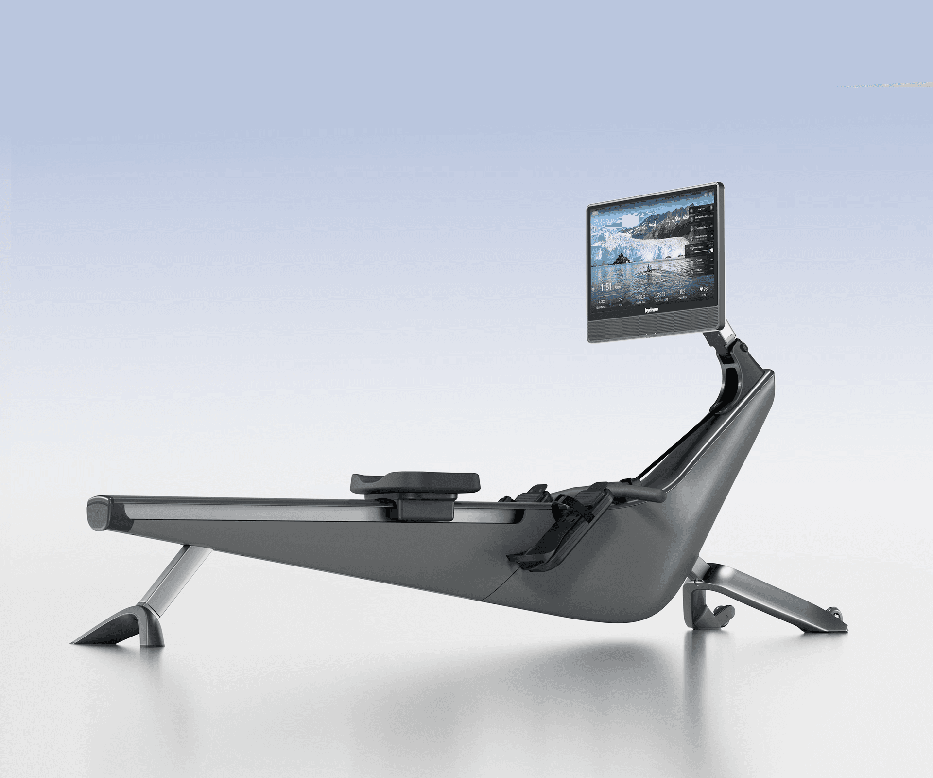 A sleek, dark grey Hydrow Arc premium rower with a large screen displaying an outdoor rowing workout.