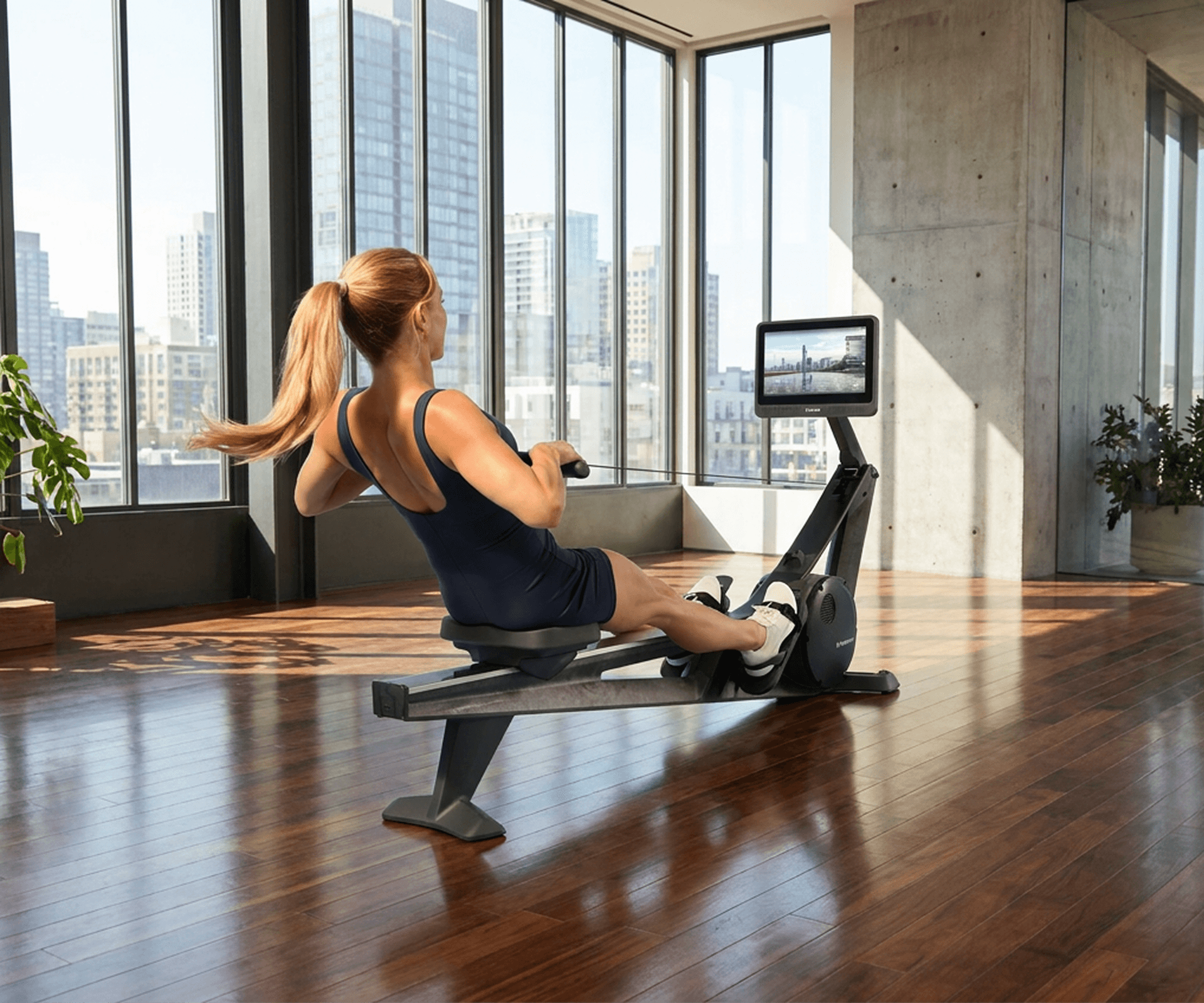 Rower being used by a woman during a workout