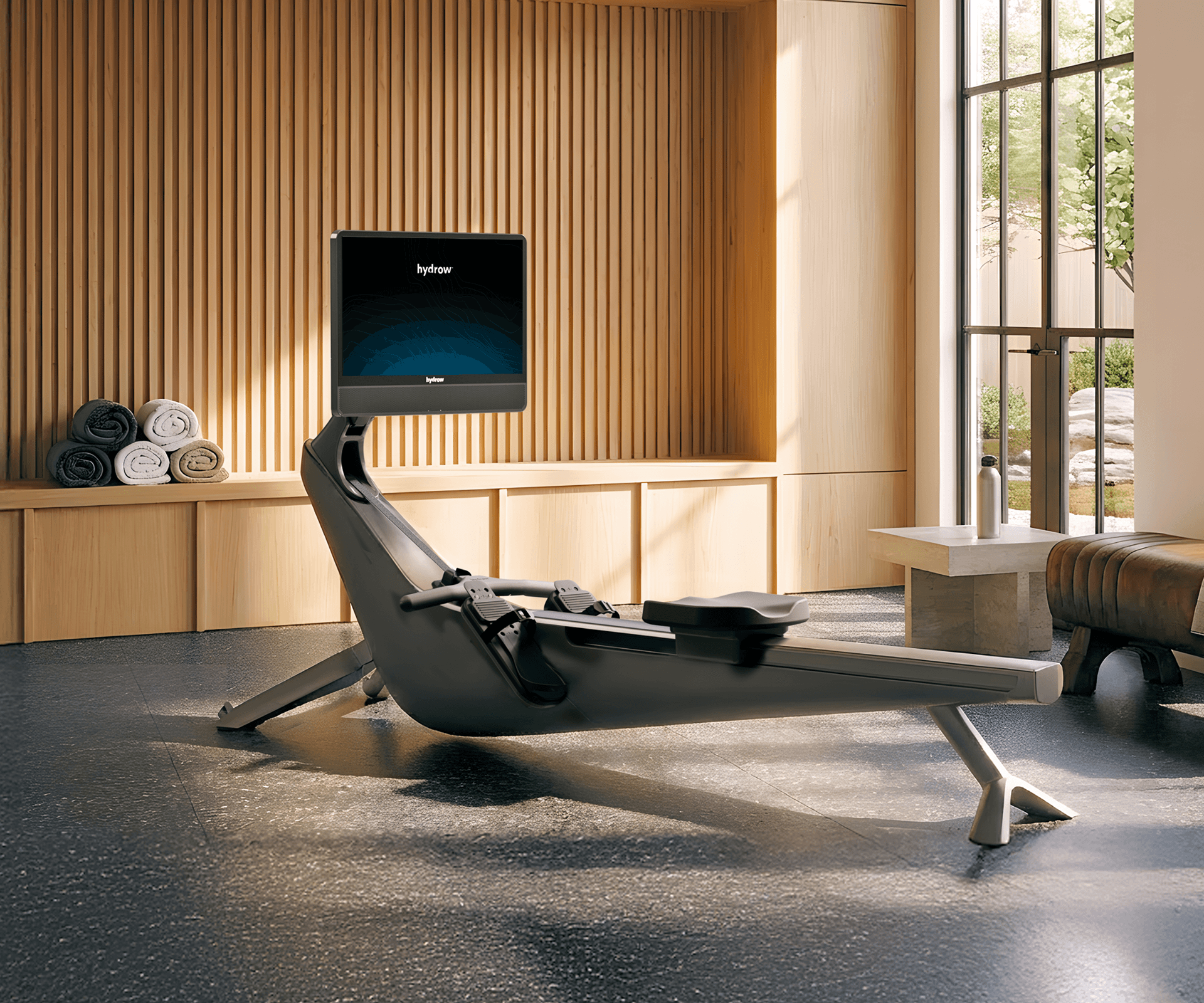 Hydrow Arc rower in a modern, sunlit room.