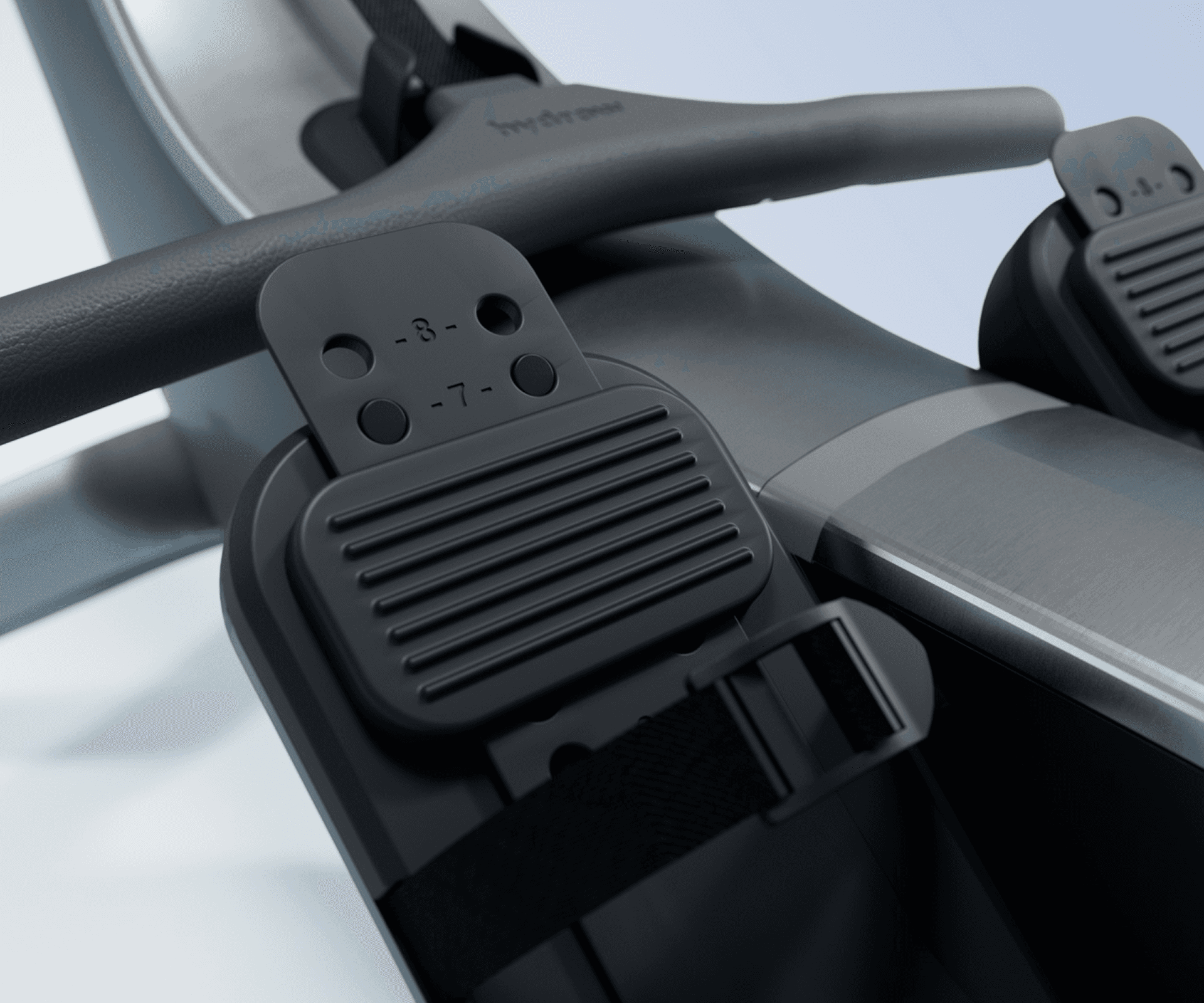 Close-up of the adjustable foot stirrups on the Hydrow Origin rower.