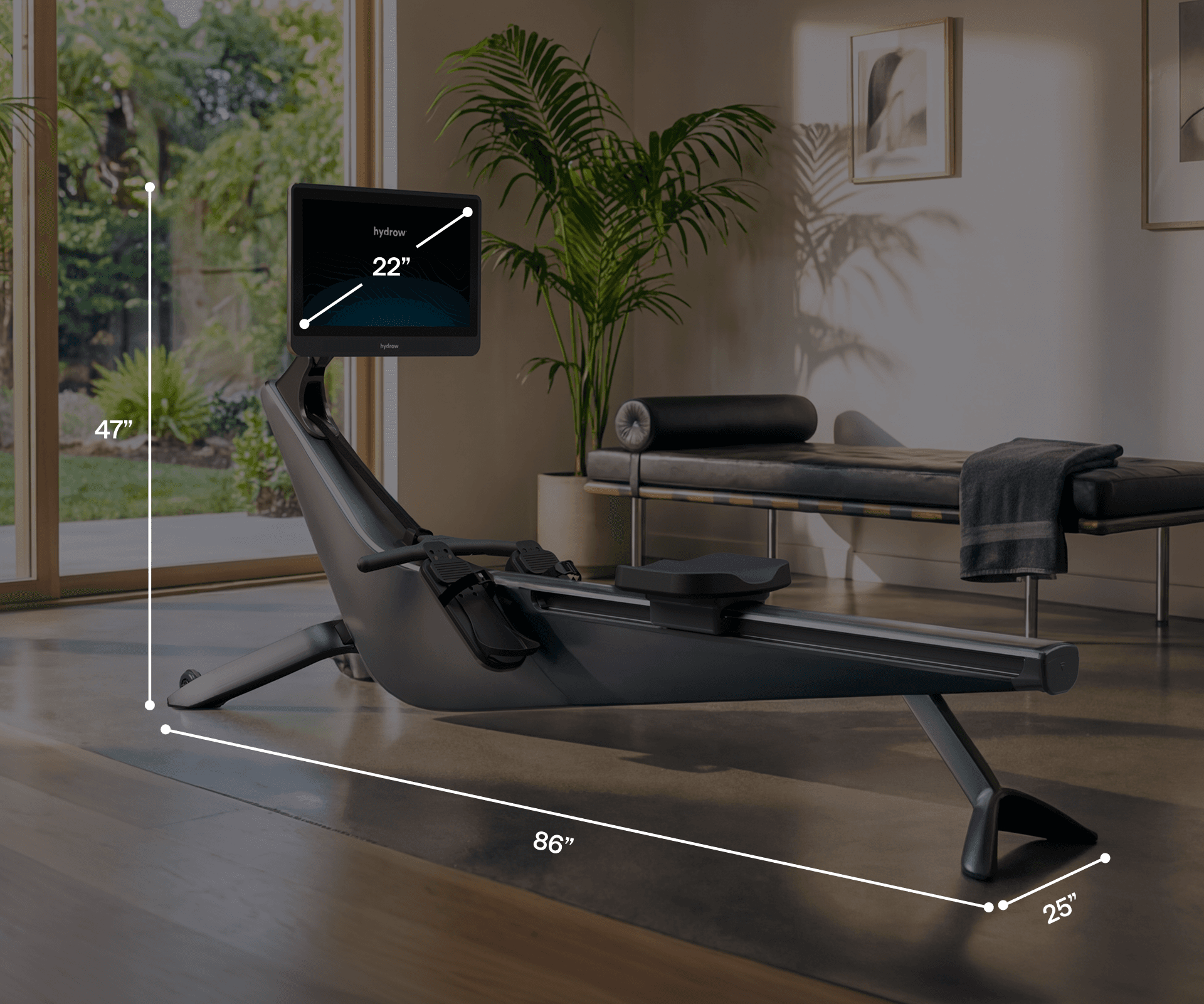 Hydrow Origin rower with its dimensions: 47" high, 86" long, and 25" wide, featuring a 22" screen.