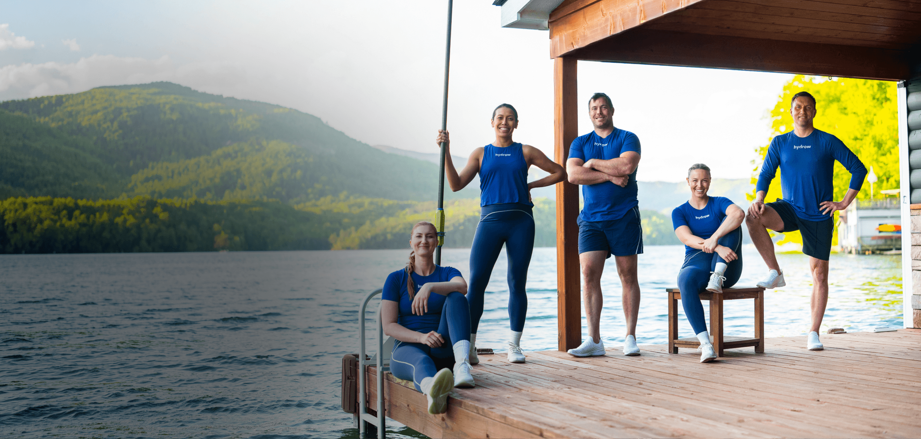 Hydrow Athletes together on a dock by the water