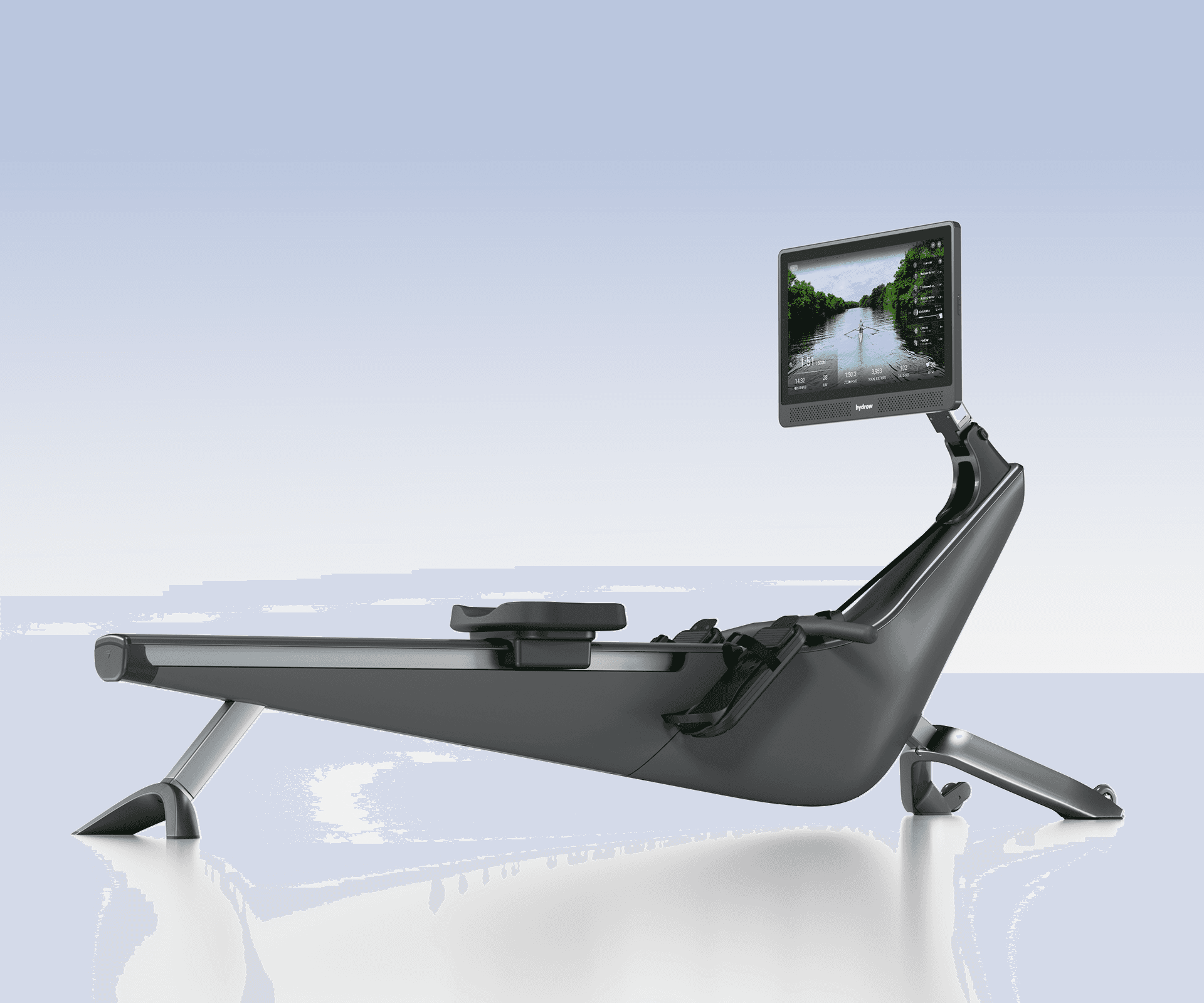 Hydrow Origin Rower, a sleek dark gray premium rowing machine with a large screen displaying a virtual rowing workout.