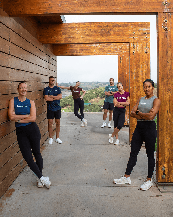 Hydrow athletes posing together in workout attire